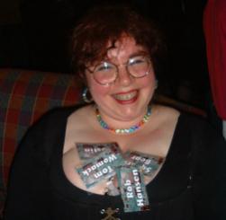 Sue Mason storing badges in her cleavage