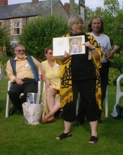 Mary Kay holding up a book